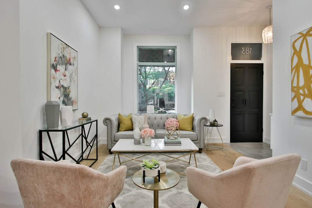 Elegant 1980s-style living room with velvet armchairs and brass accents